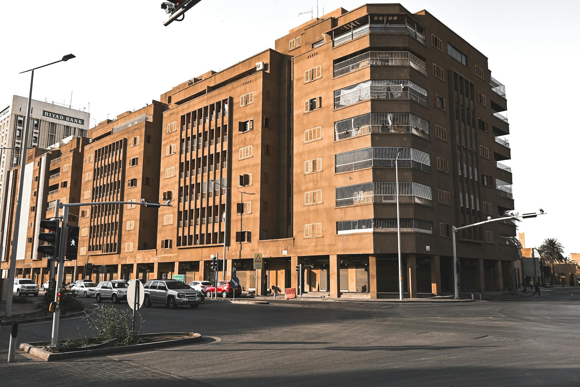 Urban scene with modern buildings and street traffic in Riyadh.